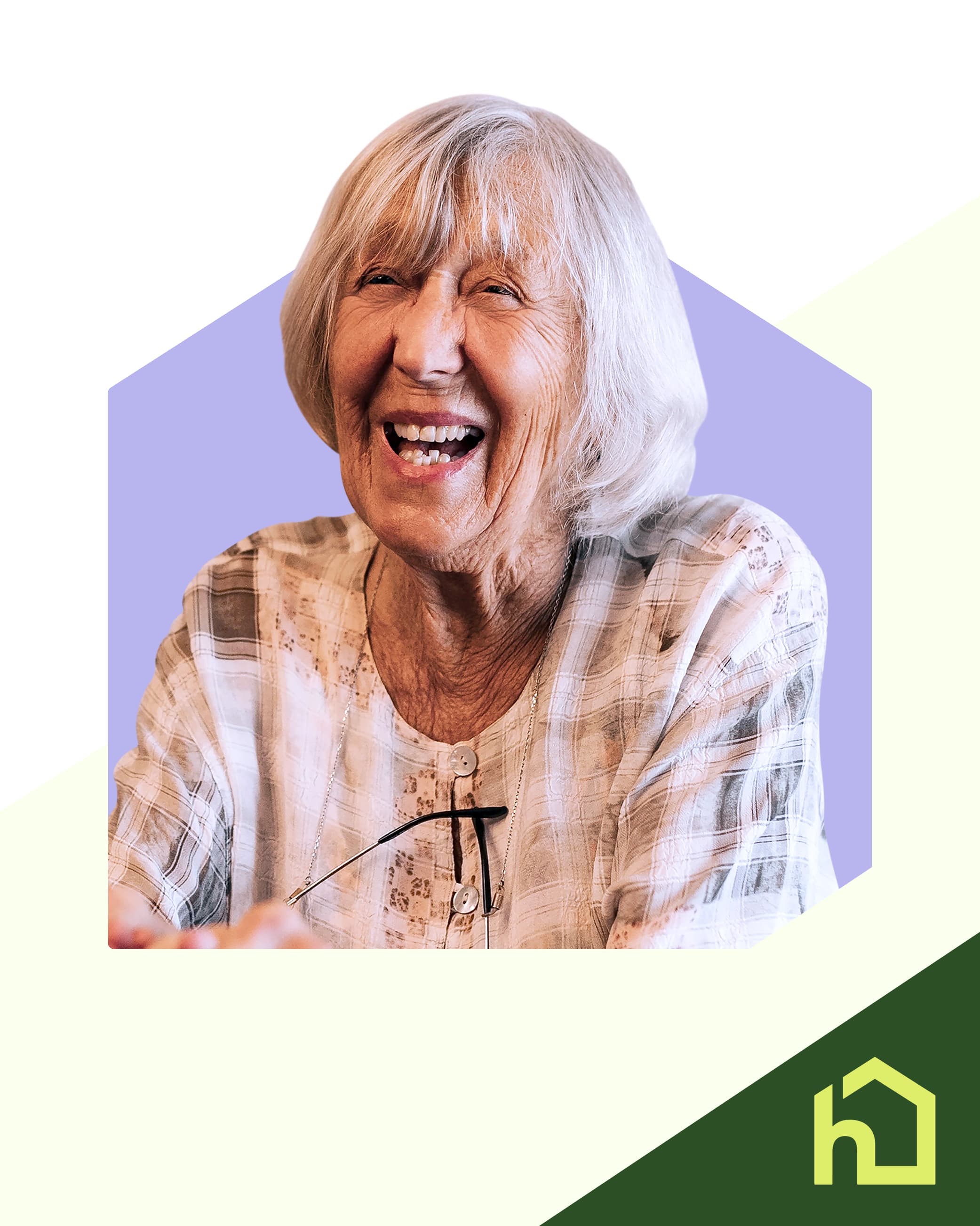 Elderly woman with grey hair in a bob beaming with joy.