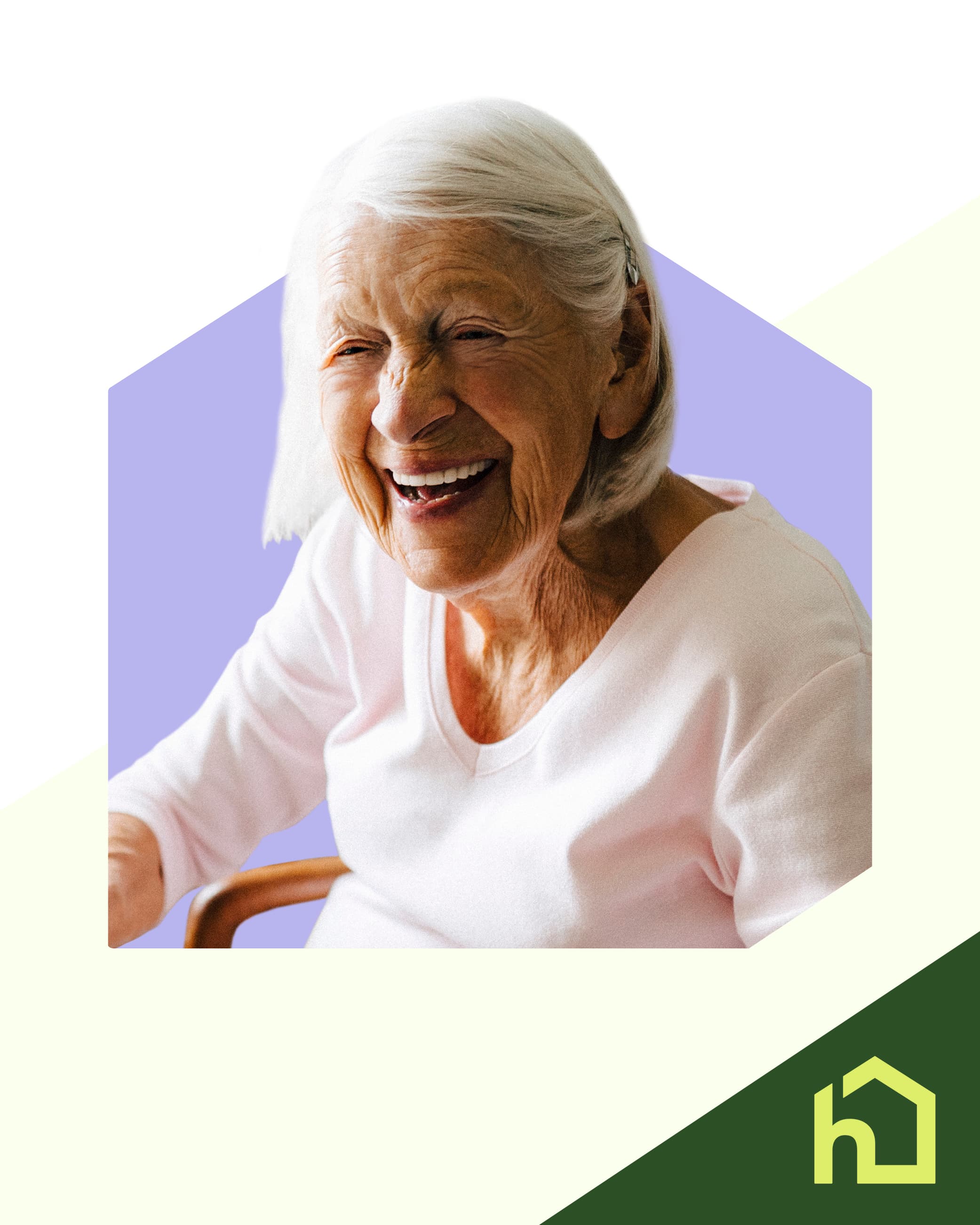Smiling elderly woman with white hair sits in a chair against a purple background. - Home Instead