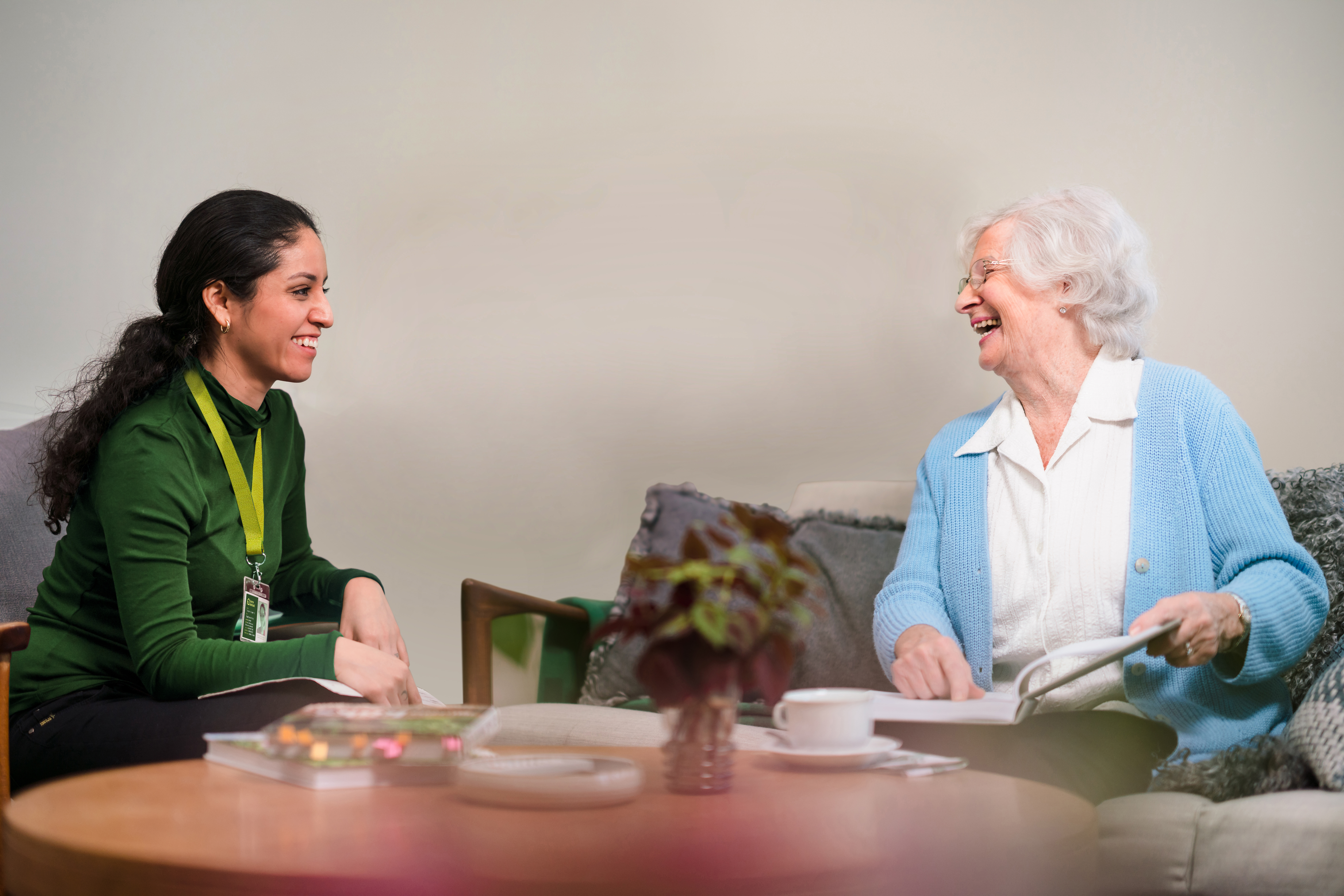 Elderly woman chatting with Care Professional - Home Instead