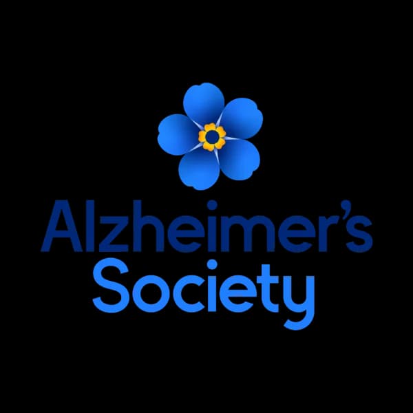 Alzheimer’s Society logo with a blue forget-me-not flower above the organization’s name in blue text. - Home Instead