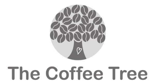 Monochrome logo of "The Coffee Tree" featuring a tree with coffee bean leaves and a heart carved on the trunk. - Home Instead