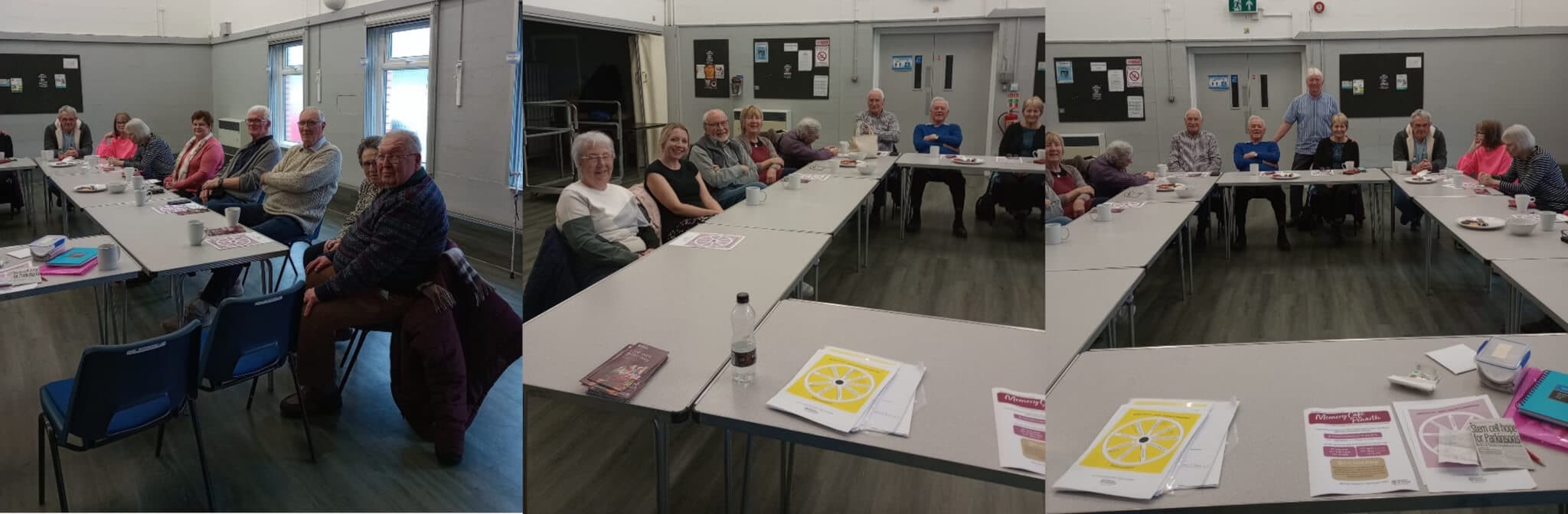 A group of older adults seated around rectangular tables in a community center, engaging in a group activity. - Home Instead