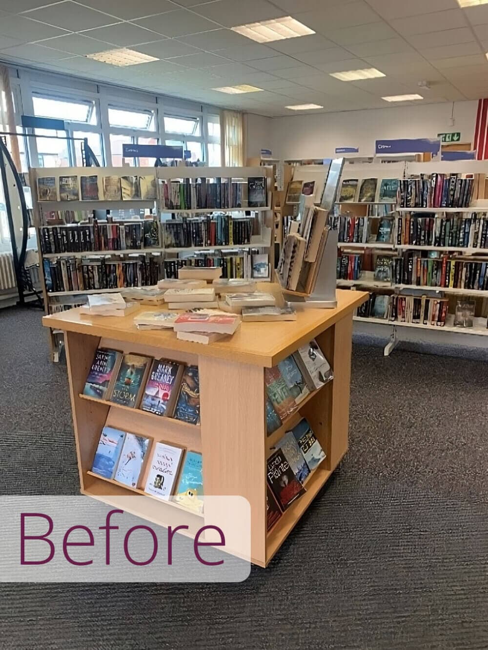 Books displayed on shelves and a wooden stand in a library, with the word "Before" in the bottom left corner. - Home Instead