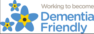 Blue and yellow flowers with the text, "Working to become Dementia Friendly. - Home Instead