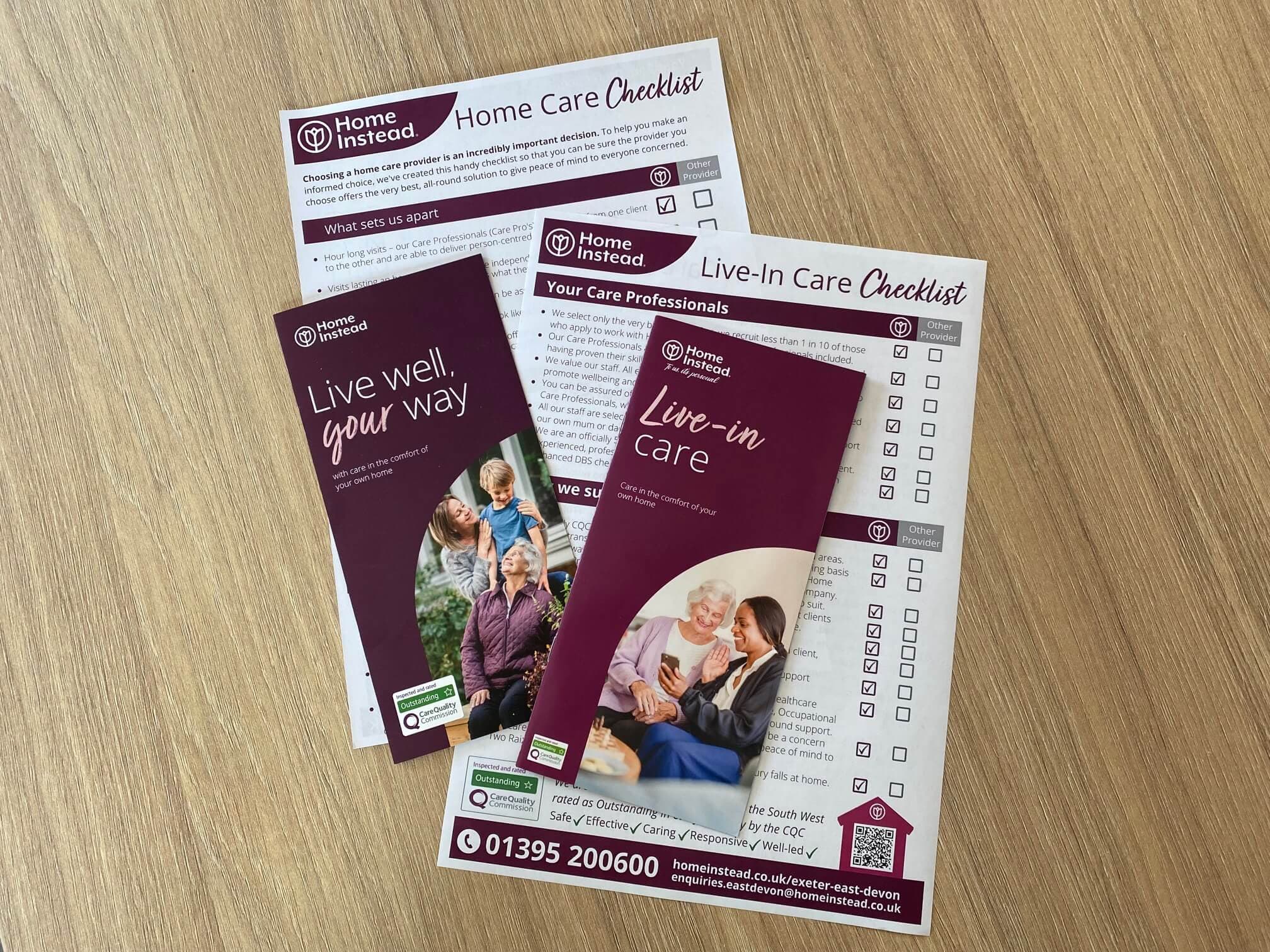 Two Home Instead brochures and checklists for home and live-in care on a wooden surface. - Home Instead