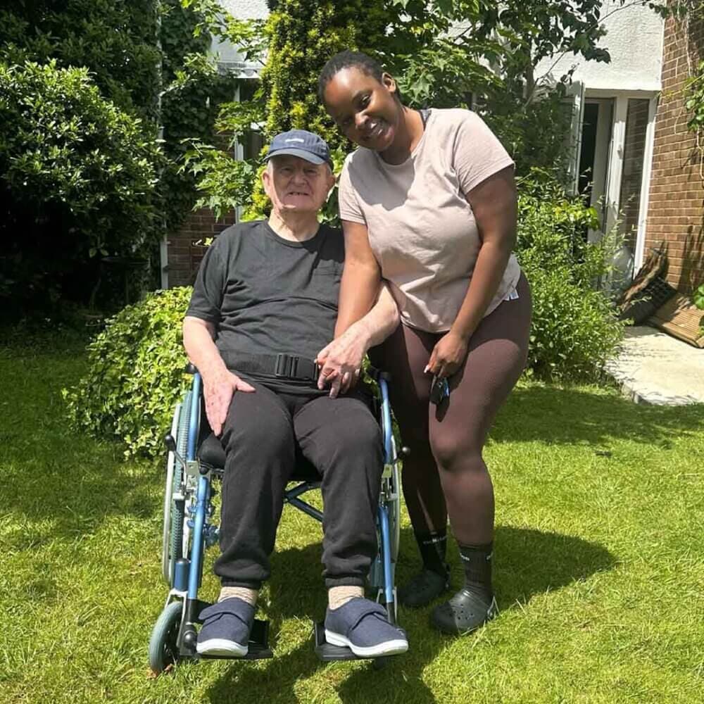 Brian Lynch and his Care Pro Kundi in the sunshine in the garden