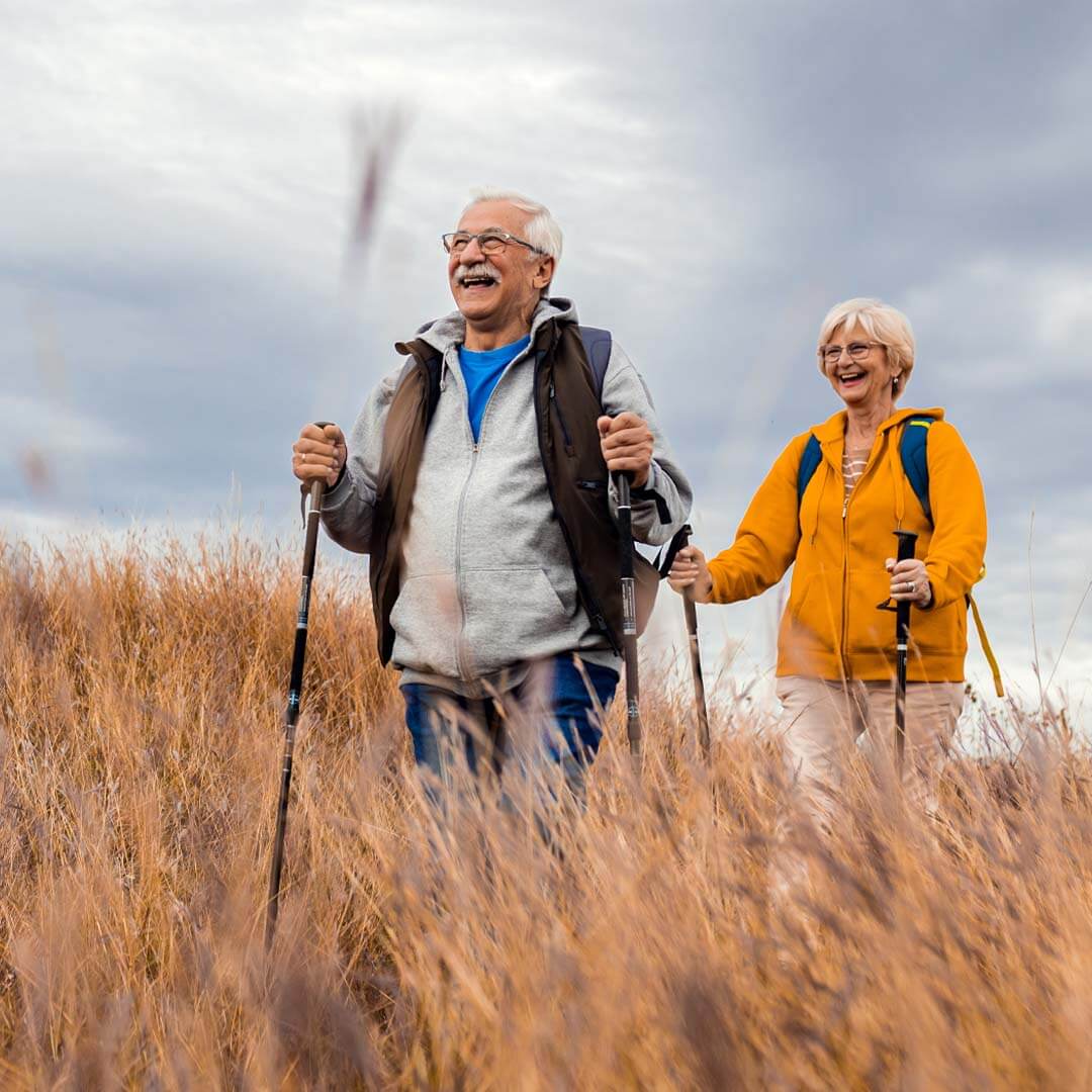 senior couple outdoors hill walking
