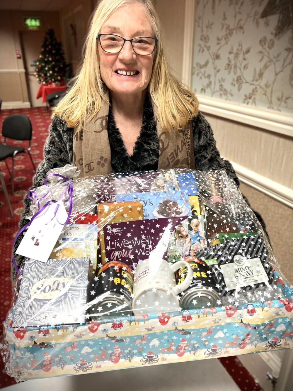 Woman receiving box of gifts