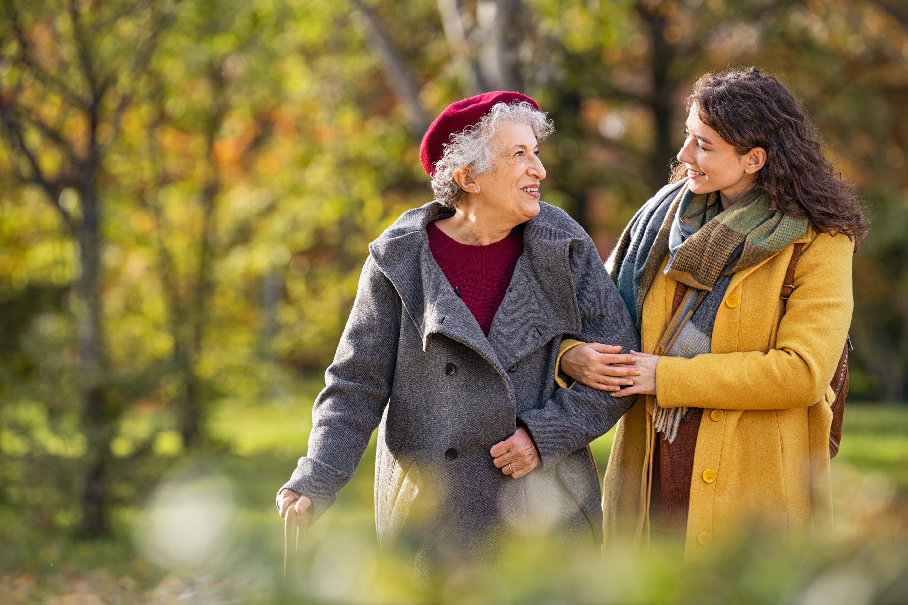 Caregiver takes elderly lady for a walk in Hagley